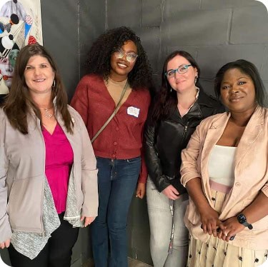 Four women recruiters smiling